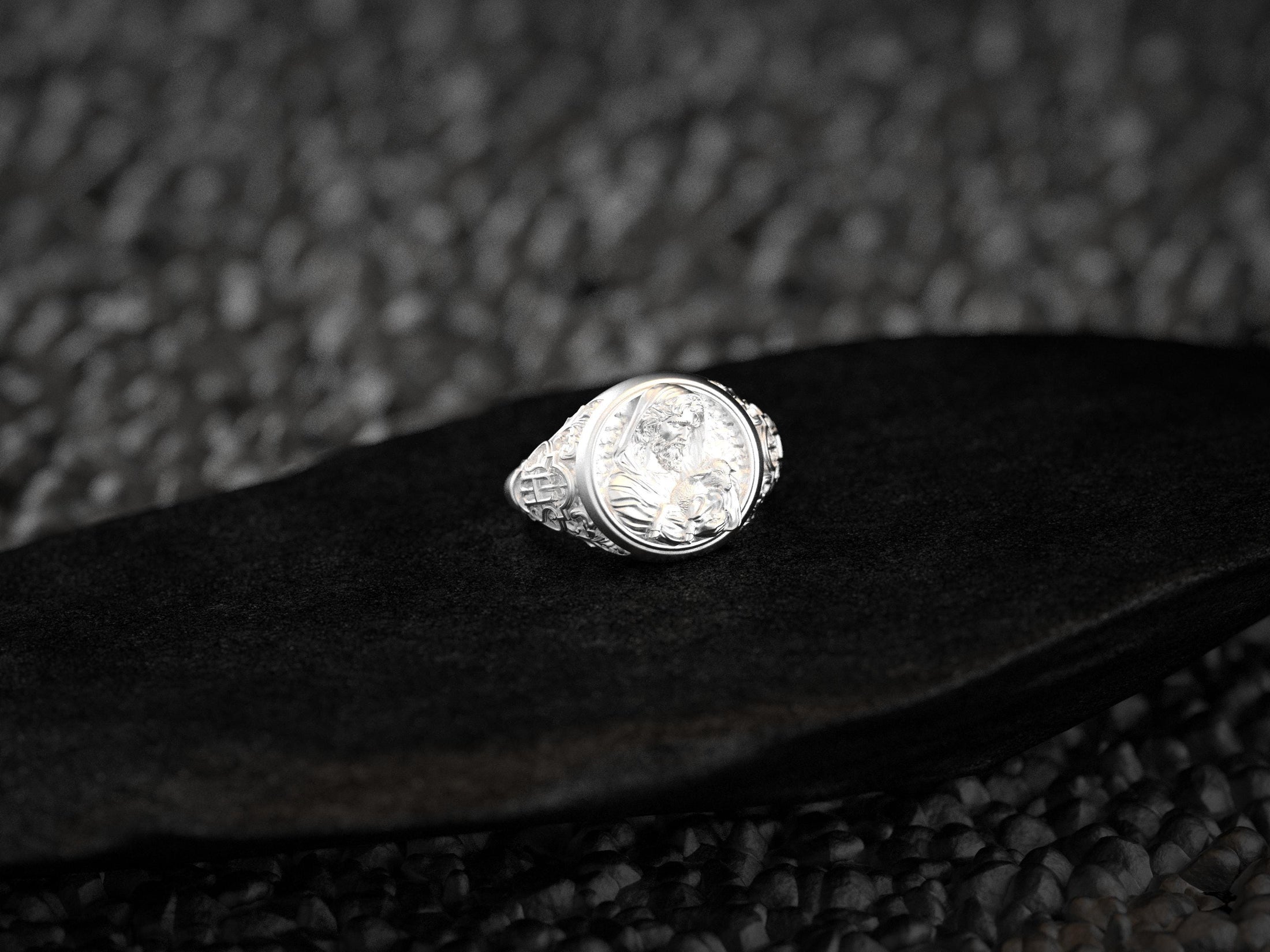 Three-quarter angle showing the shepherd’s profile and Celtic knot shoulder details in sterling silver.