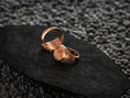 Load image into Gallery viewer, Interior view of the rose-gold plated ring, focusing on the warm plating inside the band.
