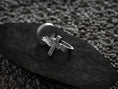 Load image into Gallery viewer, Three-quarter angled shot of the silver ring, displaying the thick comfort-fit band tapering into the detailed cross face.
