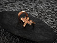 Load image into Gallery viewer, Three-quarter angled shot of the rose-gold plated ring, accentuating the silhouette of the Sacred Heart on the cross.
