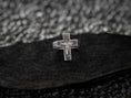 Load image into Gallery viewer, Close-up macro of the silver Christ relief, highlighting the textured radiating background within the cross arms.
