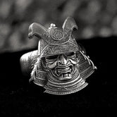 Front view of detailed samurai helmet ring with kabuto armor design.