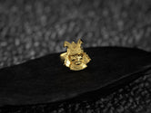 Close-up of samurai mask face on warrior ring.