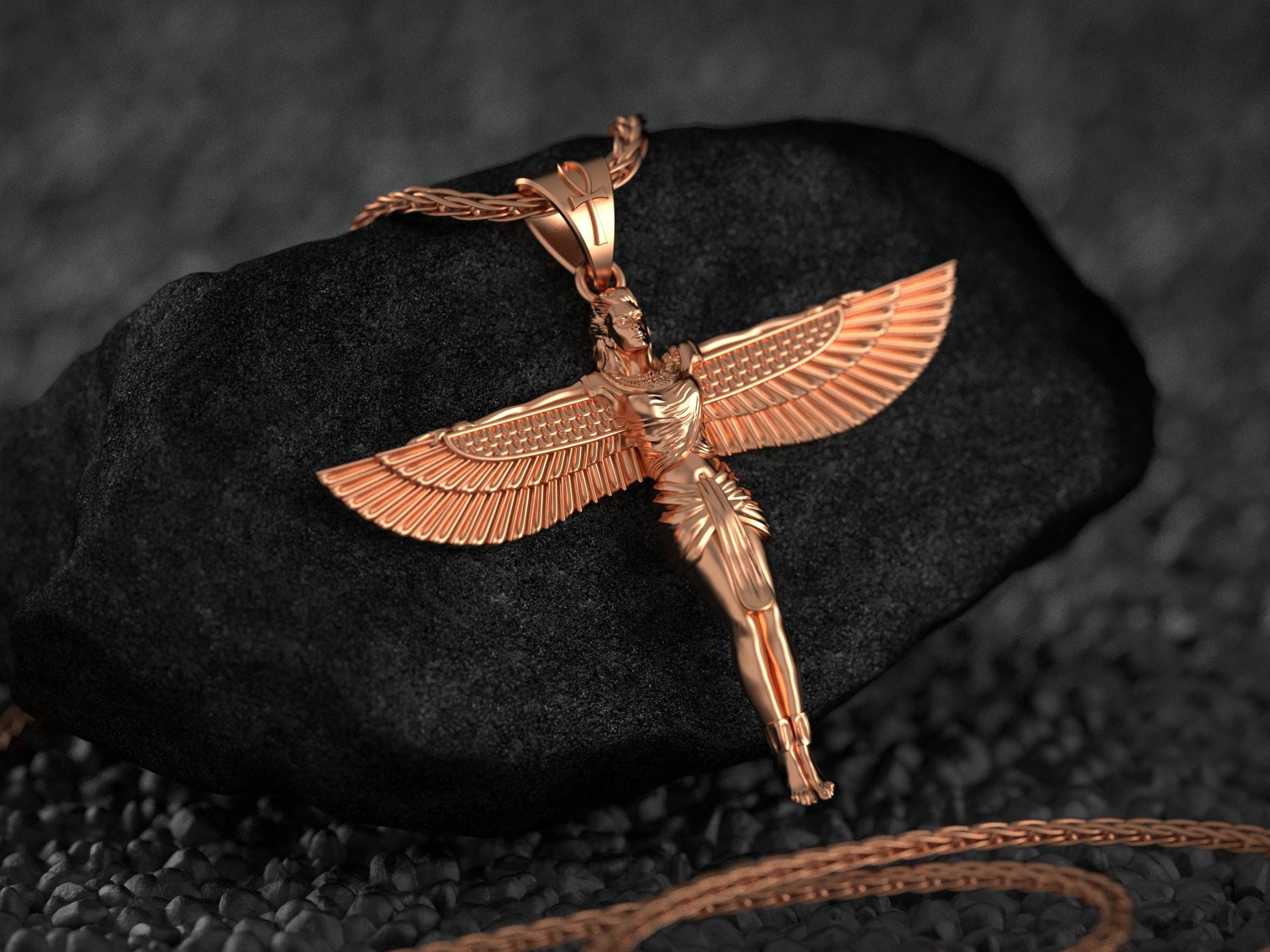 Rose gold plated Isis goddess pendant representing divine power.
