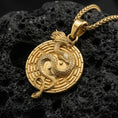 Load image into Gallery viewer, Gold plated yin yang dragon pendant necklace with eastern dragon motif photographed on volcanic rock
