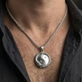Load image into Gallery viewer, Polished silver yin yang dragon medallion necklace worn on chest as symbolic jewelry for men
