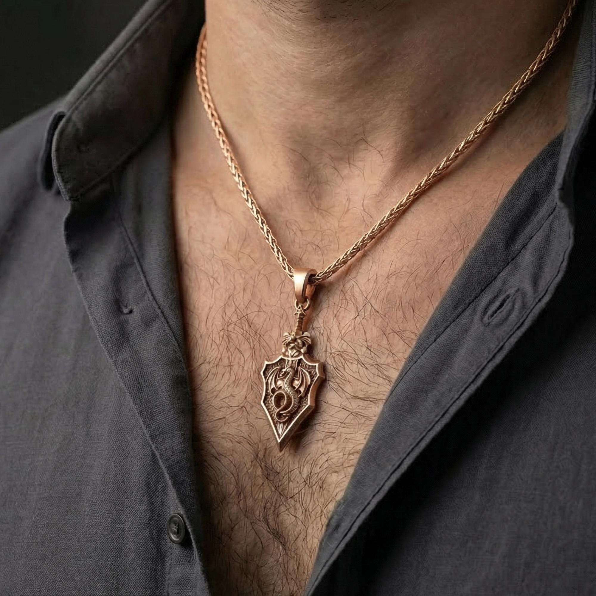 Rose gold plated dragon shield pendant worn on model as mythic dragon jewelry
