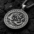 Load image into Gallery viewer, Oxidized dragon and phoenix yin yang pendant necklace on volcanic rock with mythic medallion design
