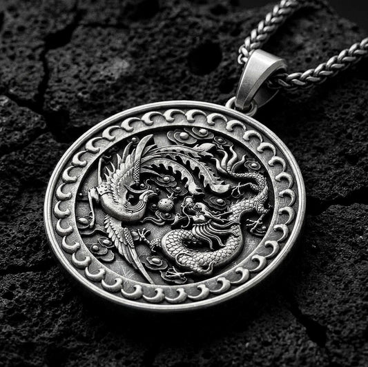 Oxidized dragon and phoenix yin yang pendant necklace on volcanic rock with mythic medallion design