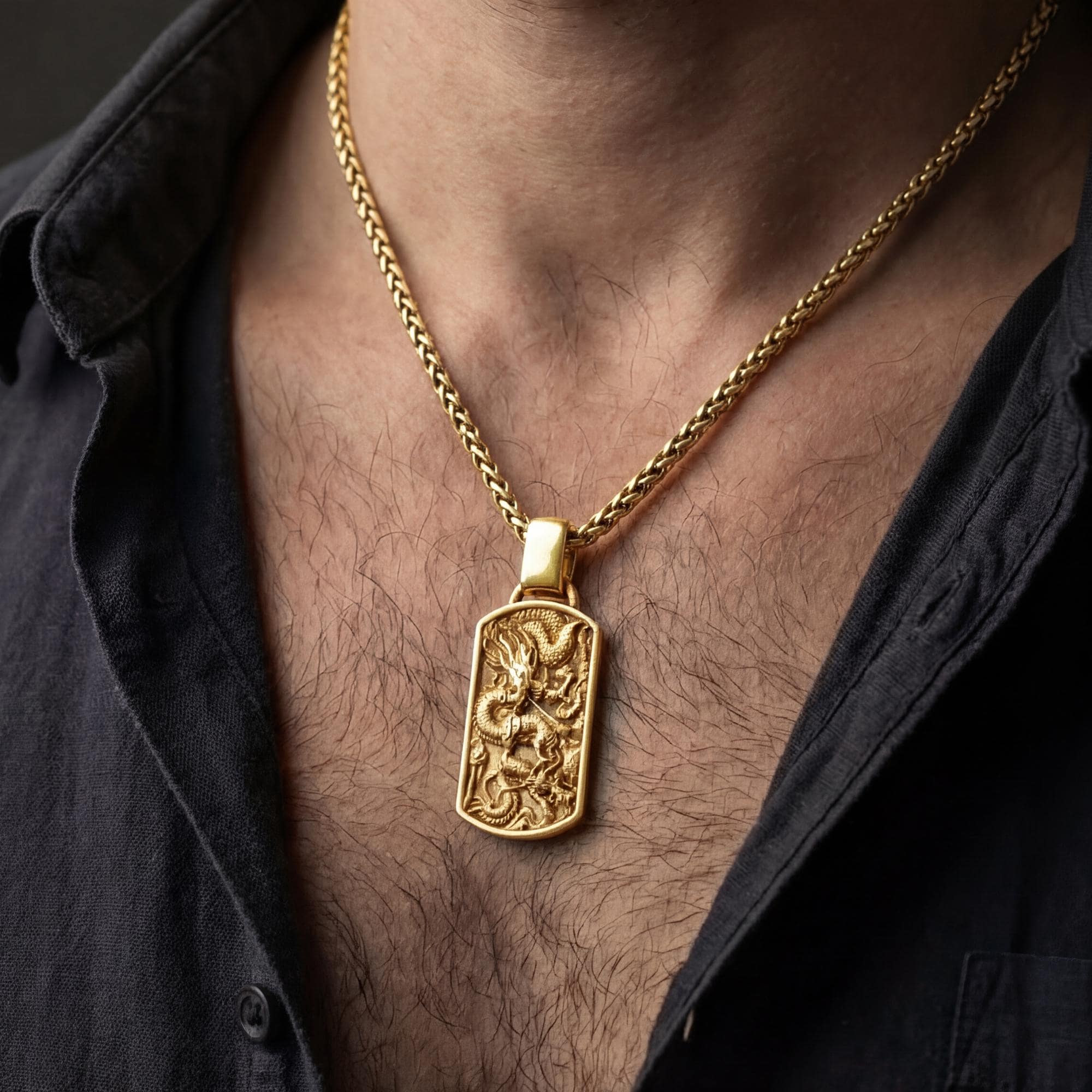 Gold plated chinese dragon pendant necklace worn by man as powerful statement jewelry