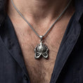 Load image into Gallery viewer, Oxidized Cthulhu octopus pendant necklace worn on male model as an eldritch talisman

