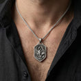 Load image into Gallery viewer, Oxidized dragon shield pendant necklace worn on male model as a guardian talisman
