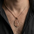 Load image into Gallery viewer, Rose gold plated coiled dragon shield necklace worn on model with powerful gothic fantasy style

