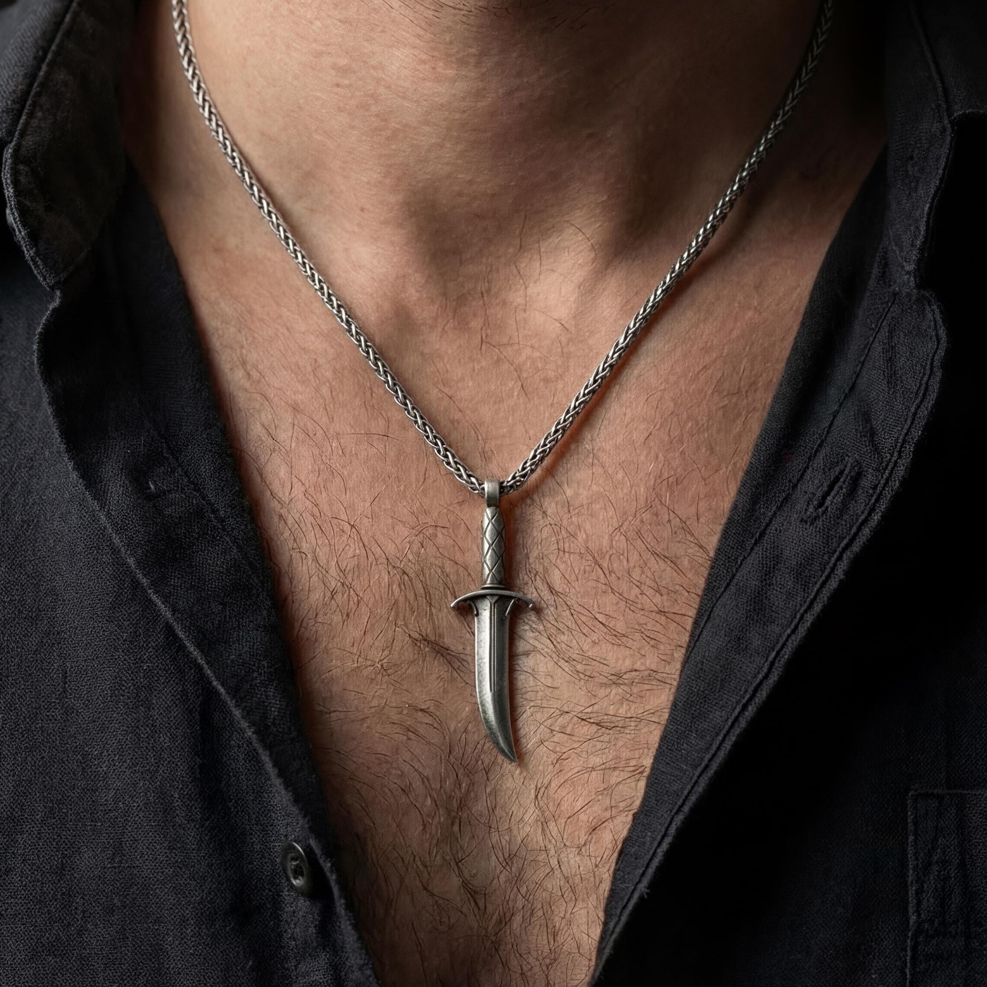 Oxidized Astarion dagger pendant necklace worn on male model as a vampire talisman