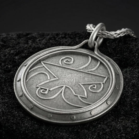 Oxidized Amulet of Zenithar pendant necklace photographed on volcanic rock with engraved Skyrim divine symbol