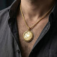 Load image into Gallery viewer, Gold plated Amulet of Zenithar necklace worn by man as meaningful fantasy statement jewelry

