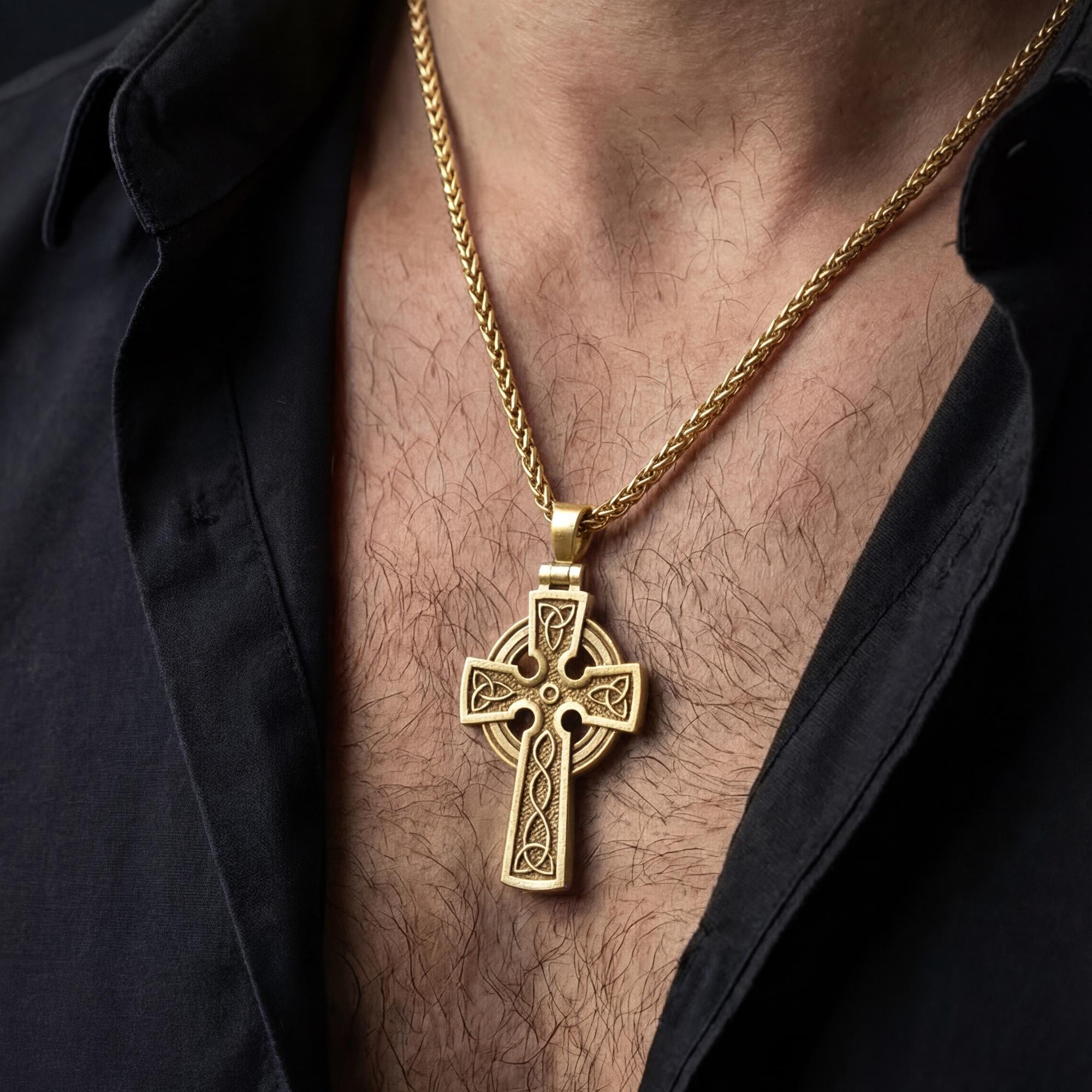 Gold plated celtic cross necklace worn by man as meaningful religious jewelry