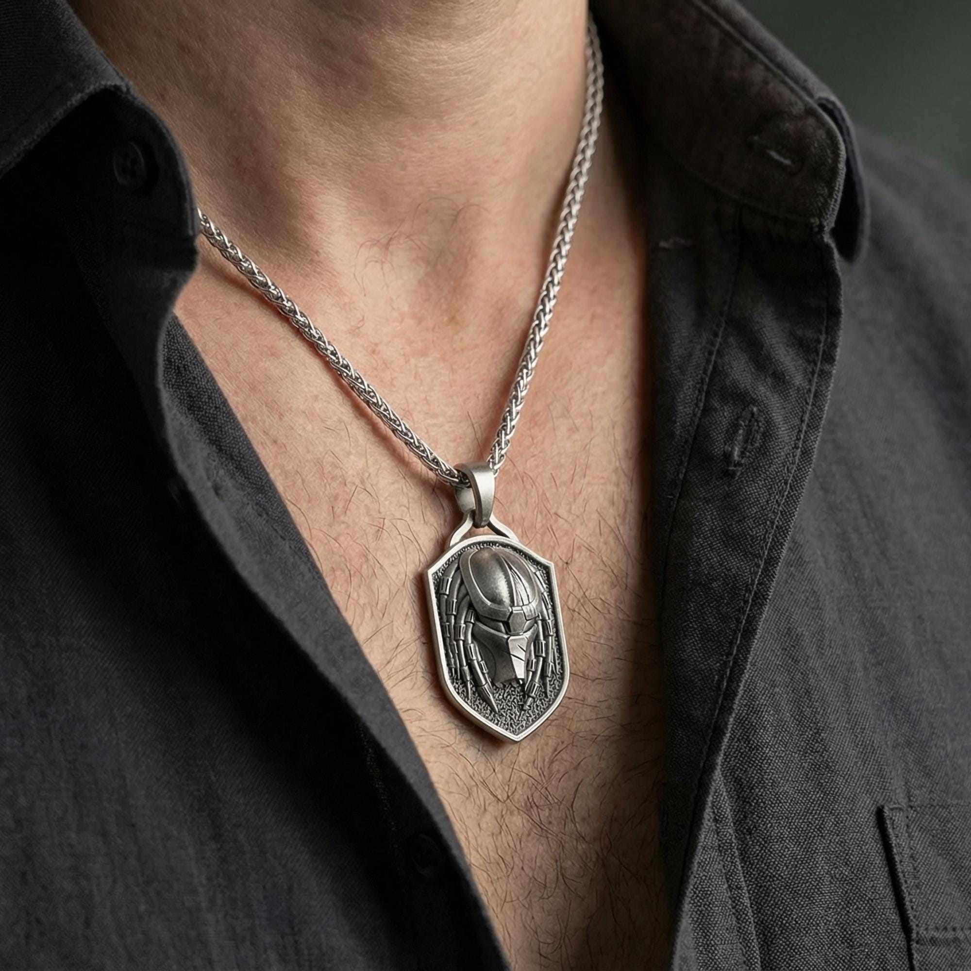 Oxidized sterling silver protective eye ring worn on the finger, lifestyle image presenting bold contrast, mystical symbolism, and a strong statement profile.