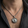 Load image into Gallery viewer, Oxidized yin yang dragon necklace worn on male model showing spiritual balance pendant
