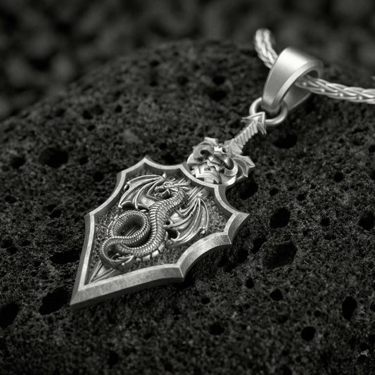 Oxidized dragon shield pendant necklace on volcanic rock with medieval crest design