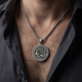 Load image into Gallery viewer, Oxidized dragon phoenix yin yang pendant necklace worn on male model as spiritual talisman
