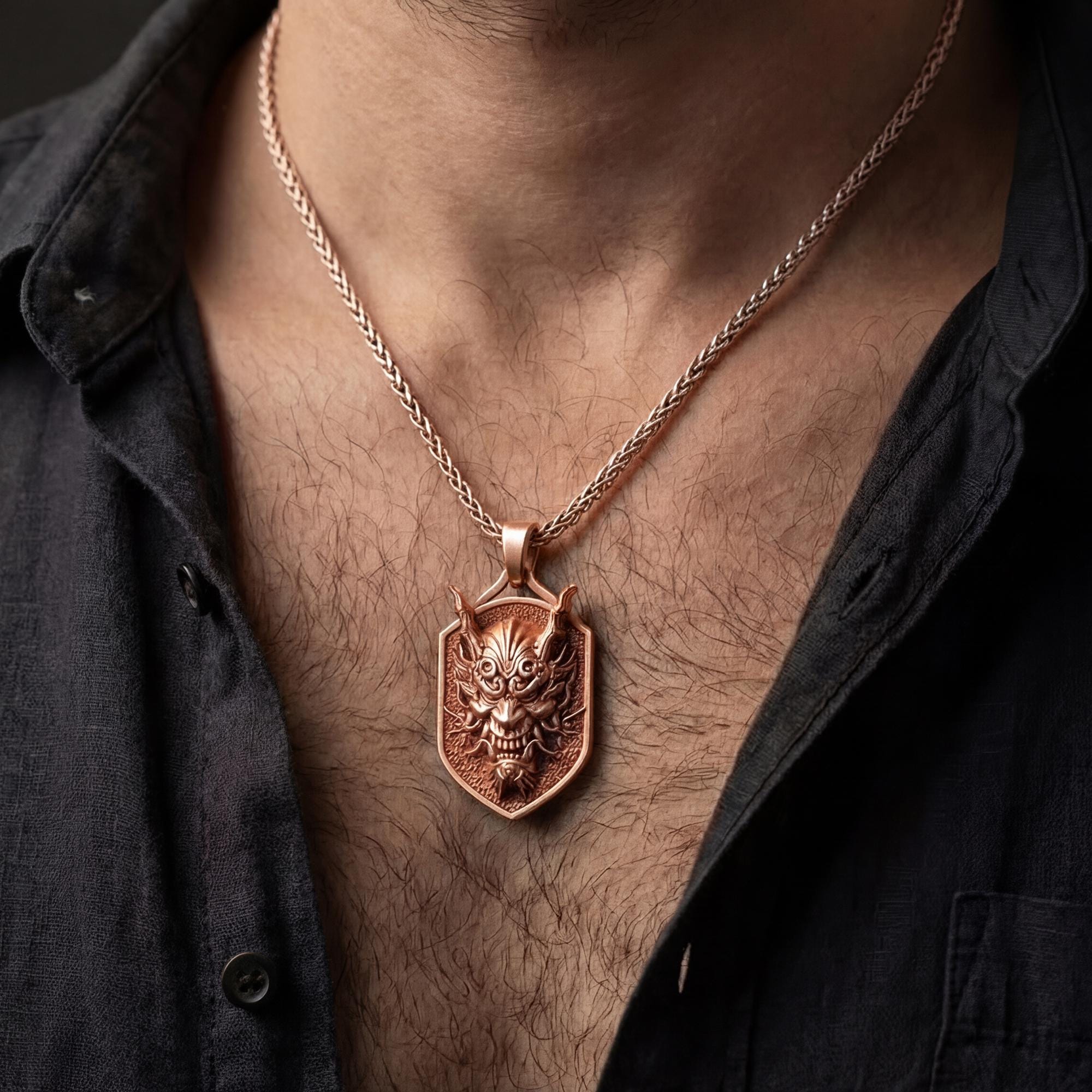 Rose gold plated demon dragon dog tag necklace worn on model with masculine dark mythic style