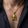 Load image into Gallery viewer, Gold plated Cthulhu pendant necklace worn by man as bold dark fantasy statement jewelry
