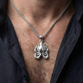 Load image into Gallery viewer, Polished silver Lovecraft octopus necklace worn on chest highlighting cosmic horror symbolism
