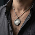 Load image into Gallery viewer, Oxidized Amulet of Zenithar pendant necklace worn on male model as a divine talisman

