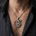 Load image into Gallery viewer, Oxidized alien xenomorph pendant necklace worn on male model as a sci-fi horror talisman
