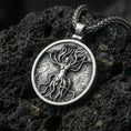 Load image into Gallery viewer, Oxidized tree of life goddess pendant necklace photographed on volcanic rock with feminine nature spirit relief
