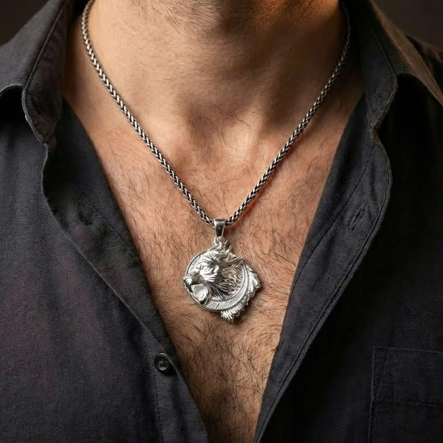 Polished silver Viking wolf Fenrir amulet worn on chest highlighting Nordic mythology symbolism
