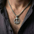 Load image into Gallery viewer, Oxidized Thor’s Hammer Mjölnir pendant necklace worn on male model as a Norse warrior talisman
