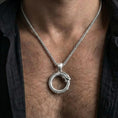 Load image into Gallery viewer, Polished silver ouroboros snake necklace worn on chest emphasizing ancient mythology and transformation
