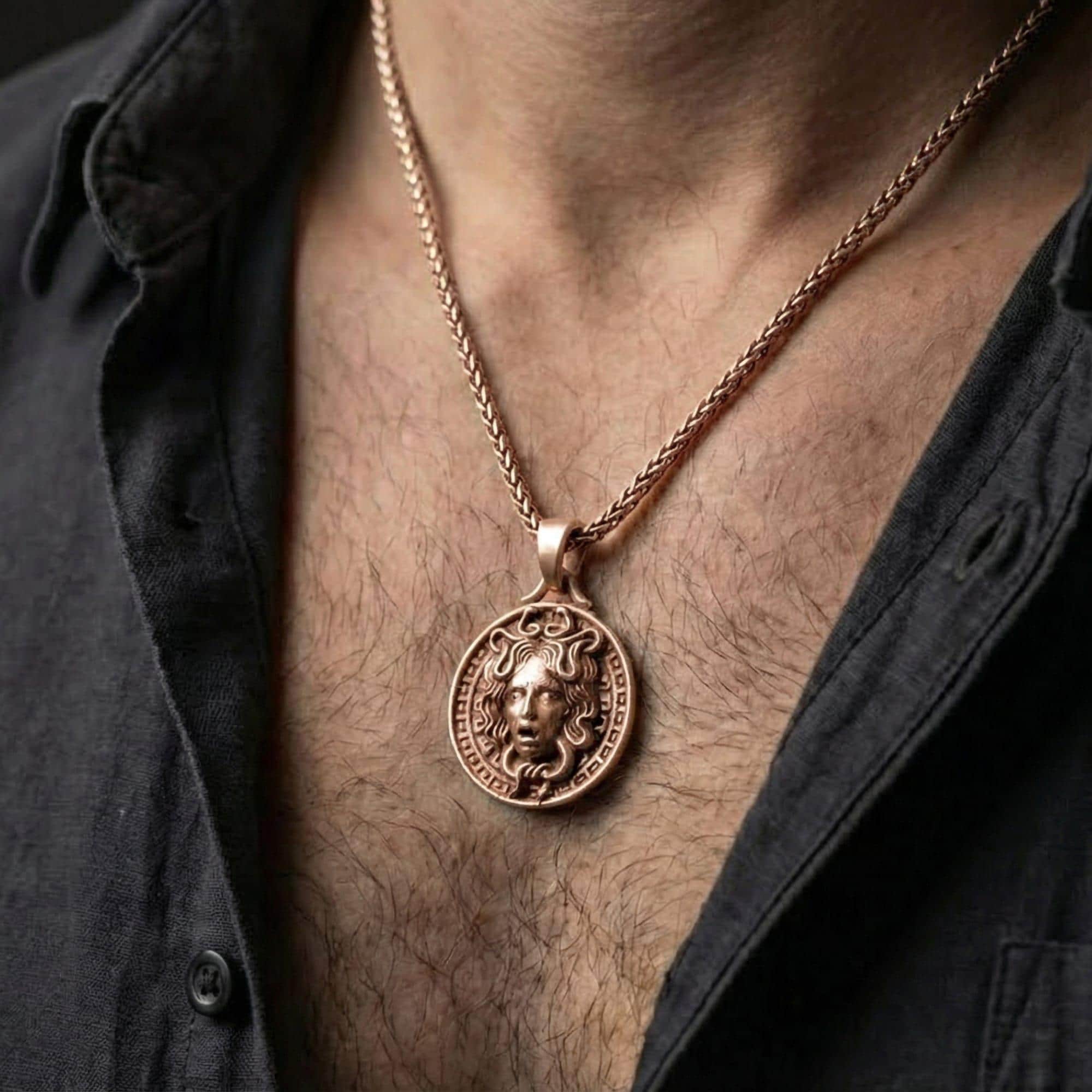 Rose gold plated Medusa necklace worn on model with timeless classical warrior style