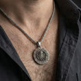 Load image into Gallery viewer, Oxidized Cthulhu pendant necklace worn on male model as an eldritch talisman
