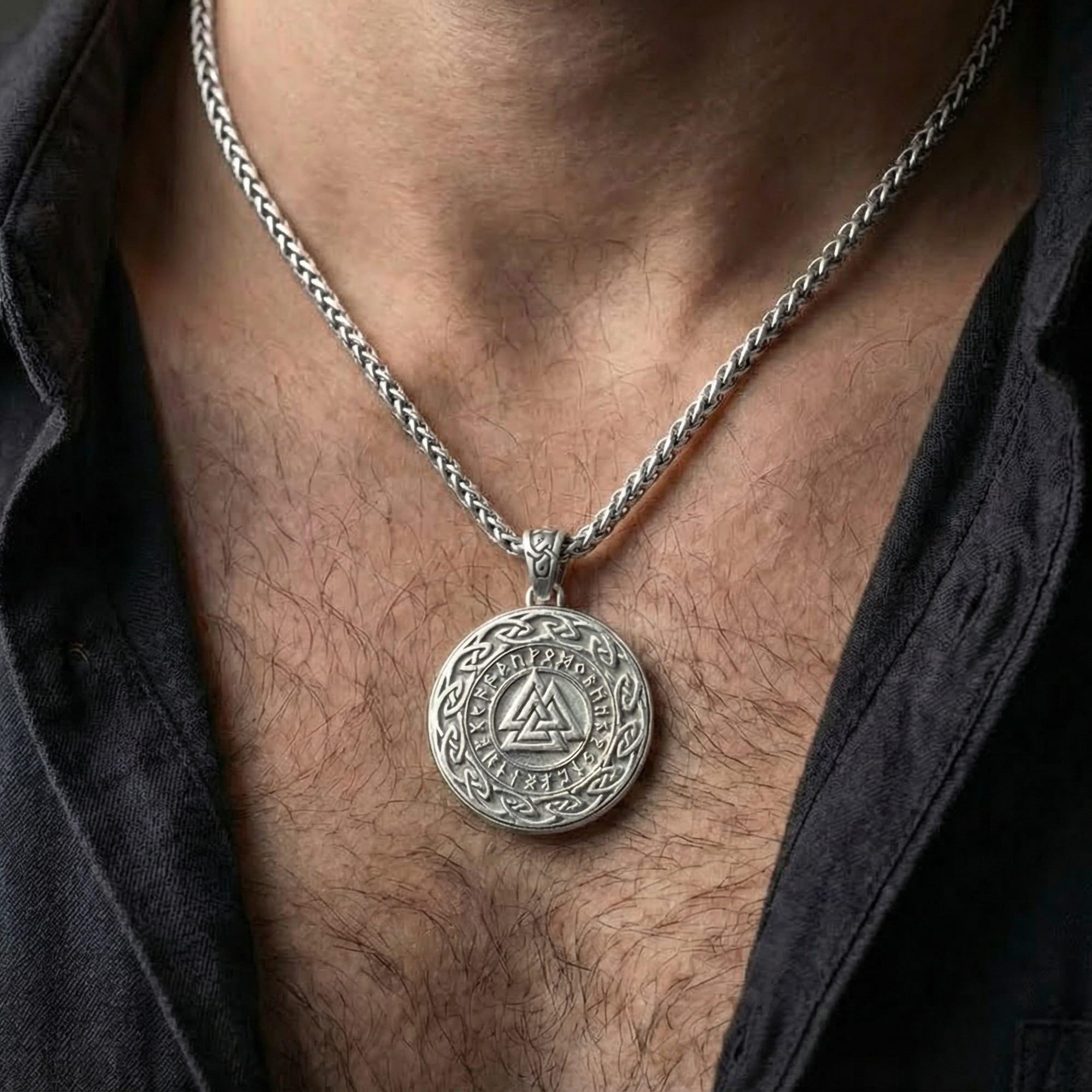 Polished silver Viking Valknut amulet worn on chest highlighting Nordic mythology and fate symbolism