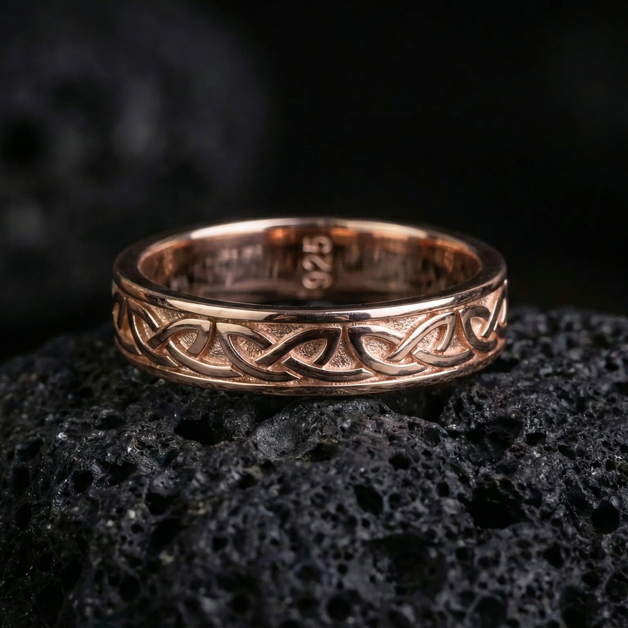 Rose gold plated Celtic love knot ring worn on model with elegant, understated Celtic style