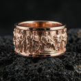 Load image into Gallery viewer, Rose gold plated Roman people relief band ring presented on volcanic rock surface with museum-grade antique aesthetic
