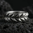 Load image into Gallery viewer, Oxidized geometric faceted silver band ring photographed on volcanic rock with sharp angular cuts and industrial modern texture
