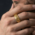 Load image into Gallery viewer, Gold plated phoenix fidget wedding ring worn by man as a powerful statement of rebirth and resilience
