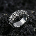 Load image into Gallery viewer, White gold Celtic knot eternity band ring with detailed triquetra pattern on volcanic stone
