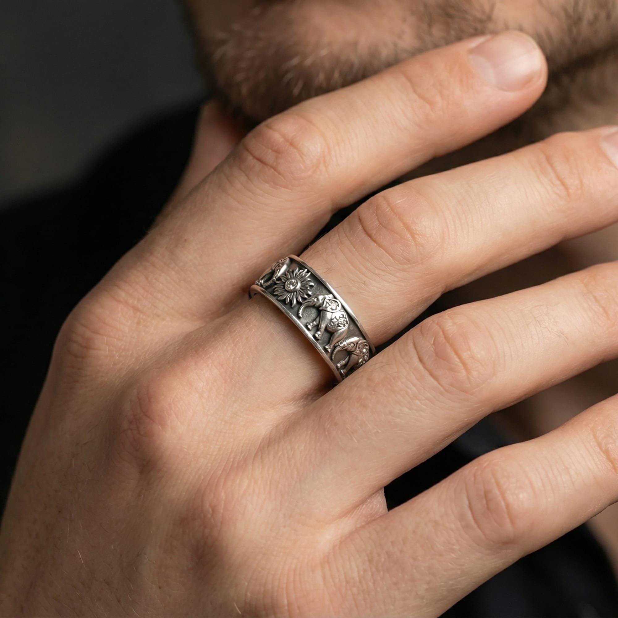 Oxidized angular faceted ring worn on finger as a rugged modern wedding band with bold geometric texture