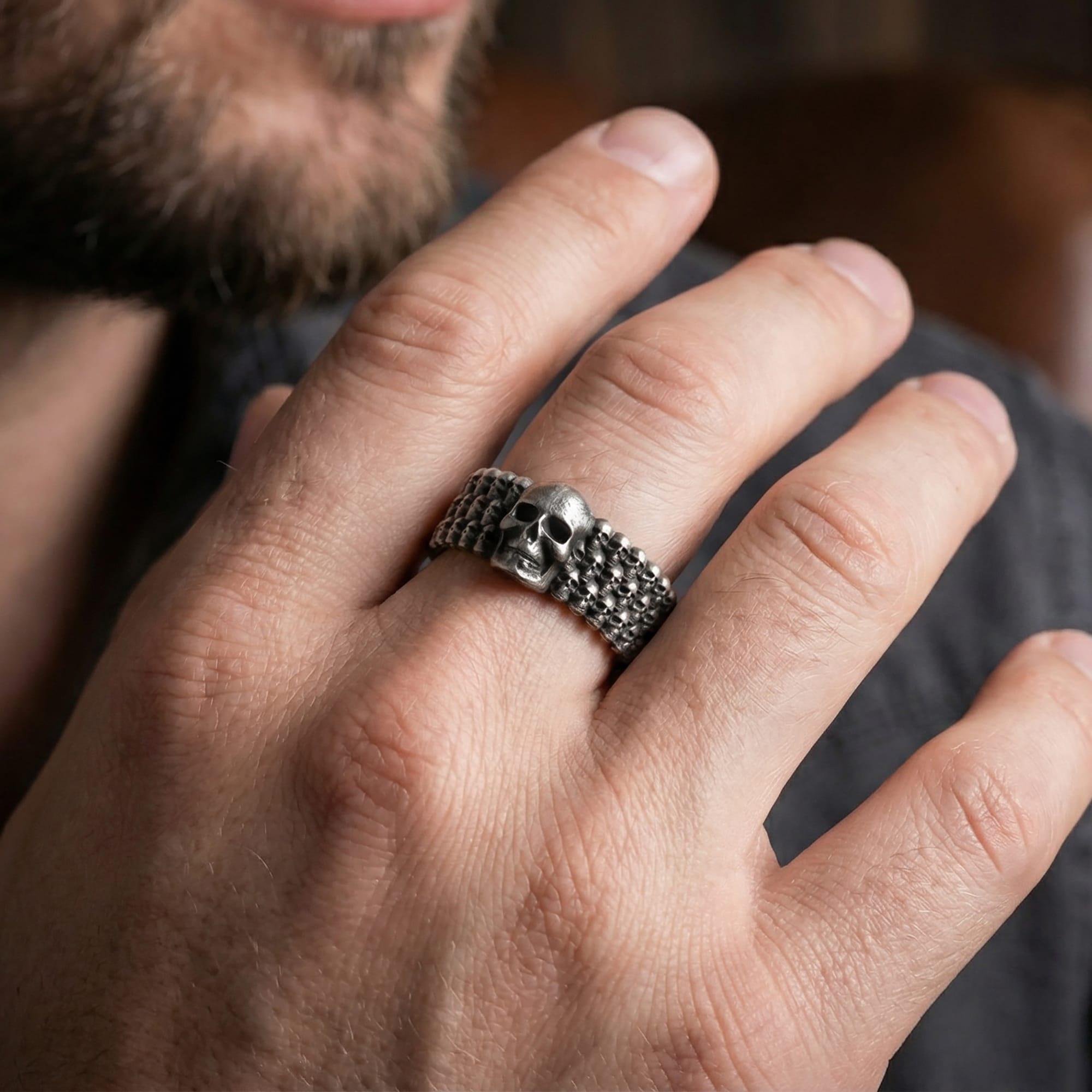 5. Oxidized faceted geometric ring worn on finger as a bold modern statement band with rugged masculine styling