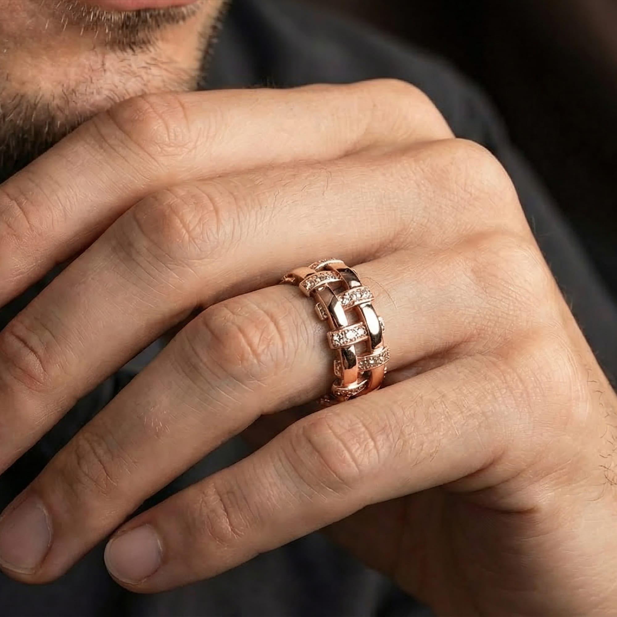 Rose gold plated wicker cross ring worn on model with refined rustic elegance and warm metallic glow