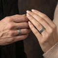 Load image into Gallery viewer, Oxidized Japanese cloud relief band ring worn on finger of a man and woman as a statement piece, emphasizing darkened depth and traditional swirl pattern definition
