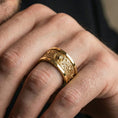 Load image into Gallery viewer, Gold plated lion crest wedding band worn by man as a power-and-leadership symbol with luxury streetwear compatibility
