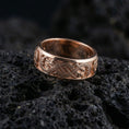 Load image into Gallery viewer, Rose Gold Slavic dragon motif ring displayed on volcanic rock highlighting Celtic-style knot details and bold mythology aesthetic
