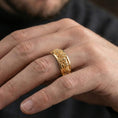 Load image into Gallery viewer, Gold plated Greek procession spinner ring worn by model as a luxury heritage statement piece with strong masculine presence
