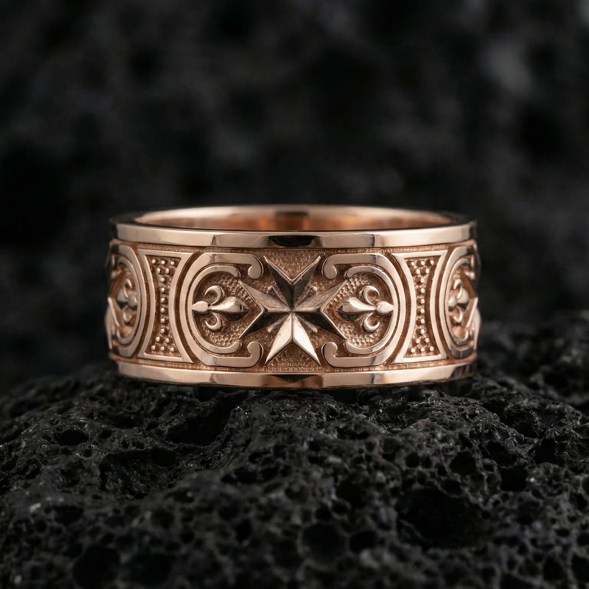 Rose gold plated medieval Maltese cross statement ring presented on volcanic rock surface, emphasizing antique-style relief work and premium handcrafted finish